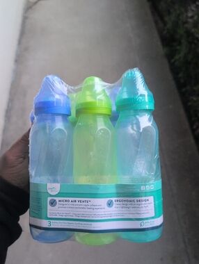 Set of 9 Plastic Evenflo Baby Bottles - Blue & Lime Green